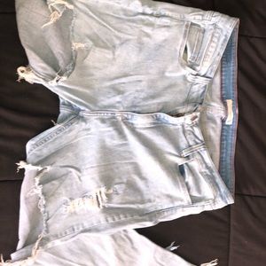 Light blue denim jeans with cuts
